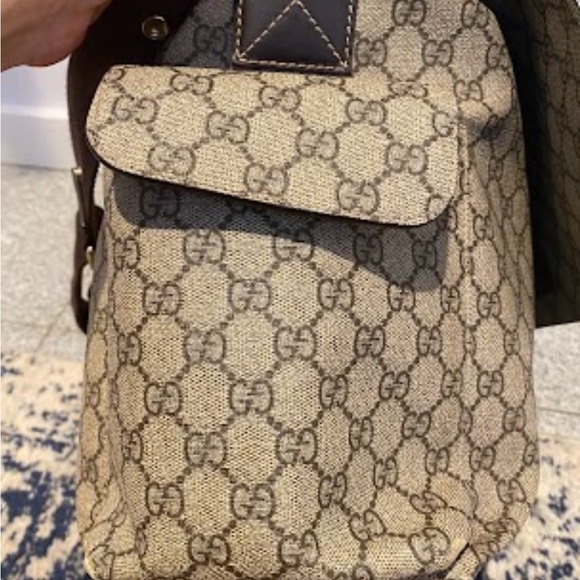 GG Supreme canvas diaper bag with multiple pockets and fold-out changing mat. - Picture 3 of 5